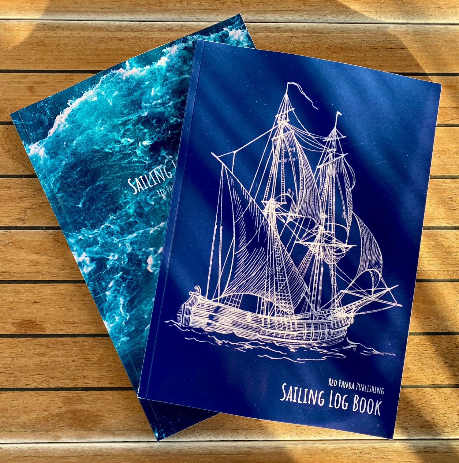 Two of the Sailing Log Book covers I published