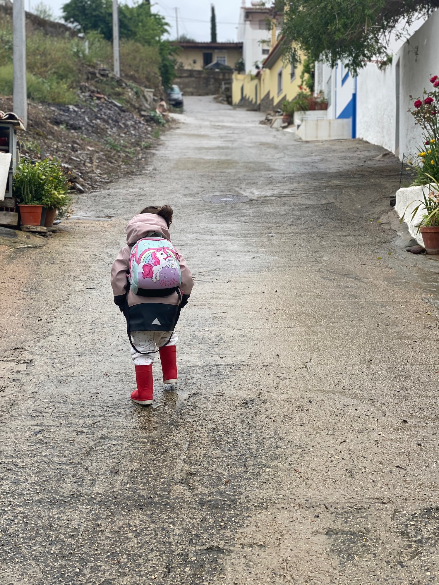 toddler on her way to nursery in Portugal